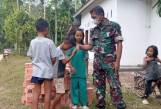 Terjalin Kedekatan Anak-anak Desa Suka Maju dengan Satgas TMMD