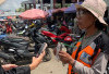 Pembayaran Parkir Via QRIS di Jambi Terkendala, Juru Parkir Minta Kelonggaran dari Pemerintah 